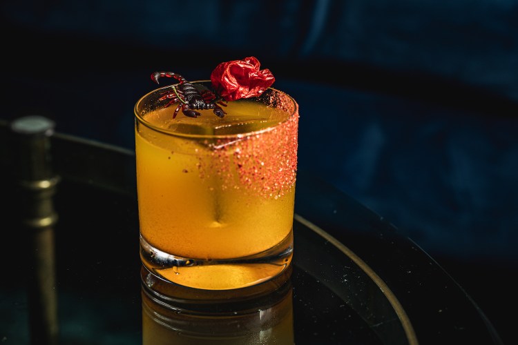 The Scorpio from Apothecary features charred-tomato and scorpion-pepper mezcal, gin, lime, pineapple, coconut water and turmeric.