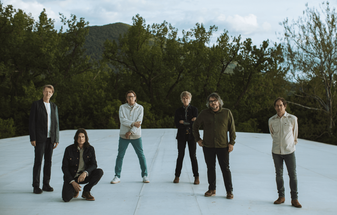 the band wilco standing on a frozen pond