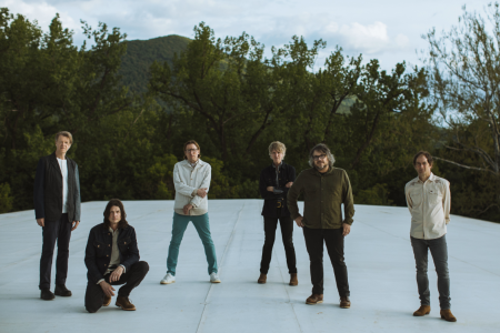 the band wilco standing on a frozen pond