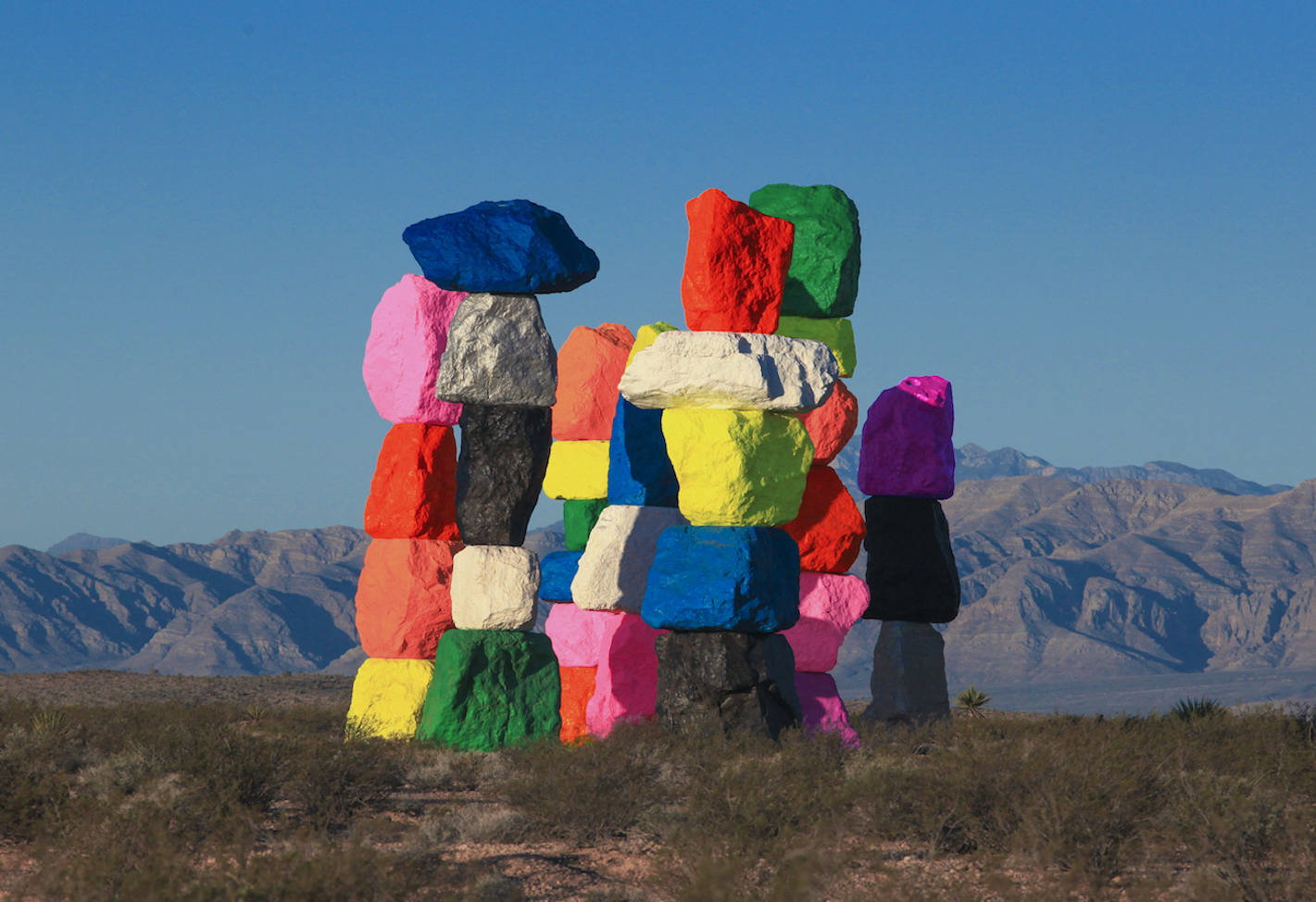 Colorful rocks piled on top of each other in a desert 