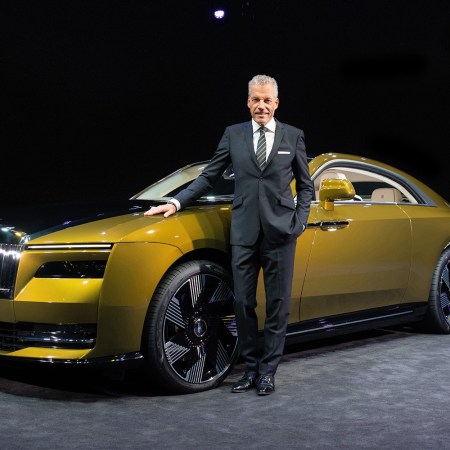 Rolls-Royce Motors Cars CEO Torsten Müller-Ötvös, who announced his retirement on October 5, next to the company's first EV, the Spectre