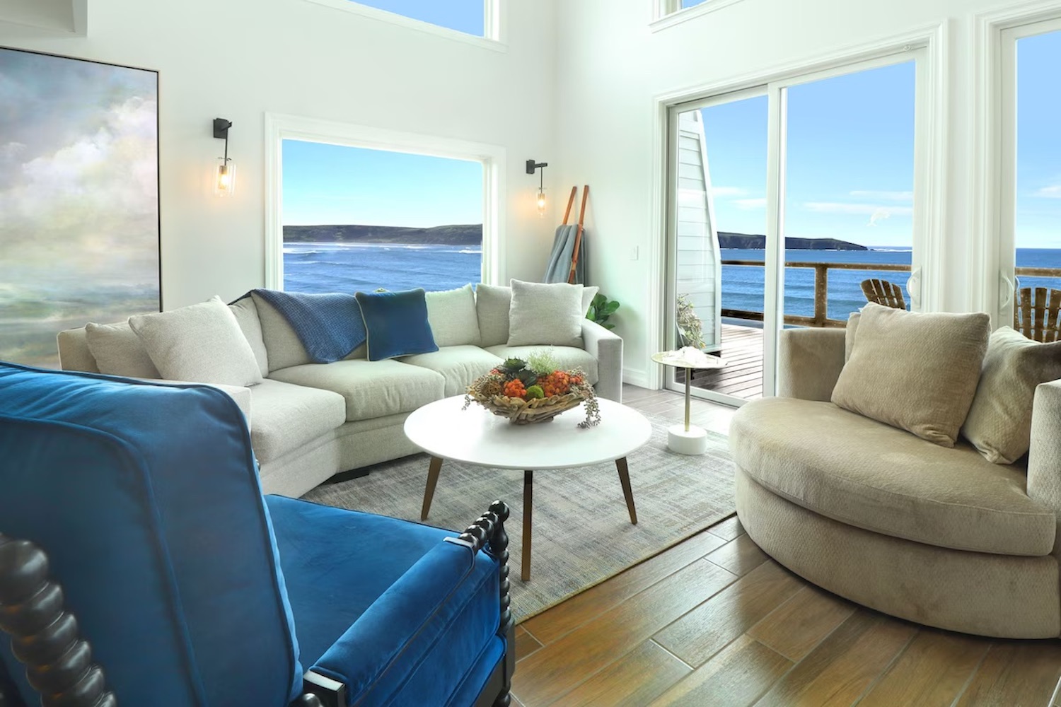 White and blue living room overlooking Pacific Ocean