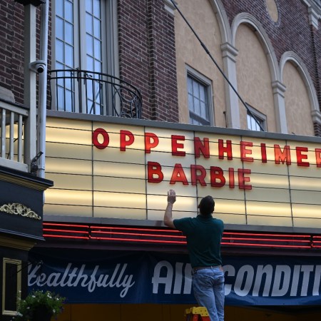 Movie theater marquee with "Barbie" and "Oppenheimer"