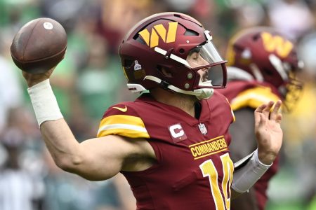Washington quarterback Sam Howell throws the ball against the Eagles.