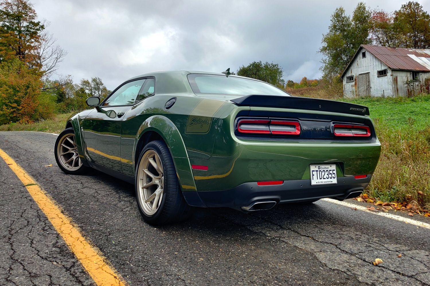 2023 Dodge Challenger Scat Pack Swinger sitting on a rural road. Here's our full review of the special-edition muscle car.