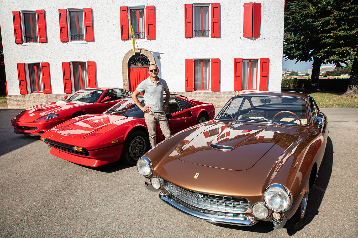 InsideHook writer Basem Wasef with the three classic Ferraris he drove as part of the Corso Pilota Classiche program