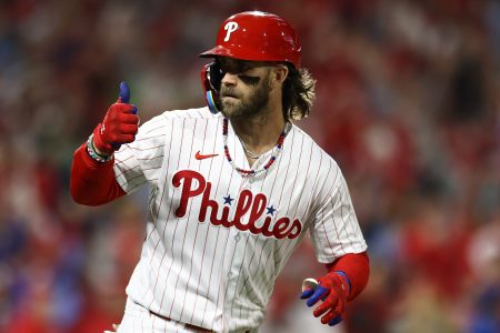 Bryce Harper of the Phillies reacts after hitting a solo home run.
