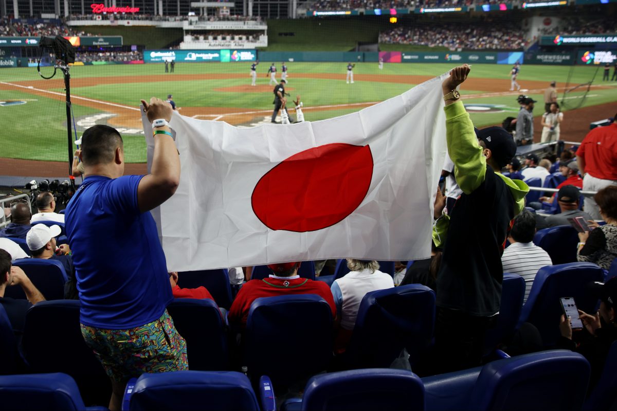 Fans hold up a Japanese flag during the 2023 World Baseball Classic.