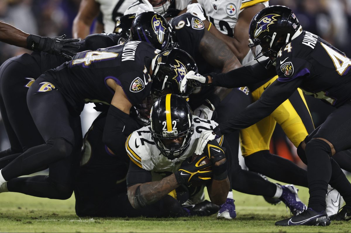 Najee Harris of the Steelers is tackled by the Baltimore Ravens.
