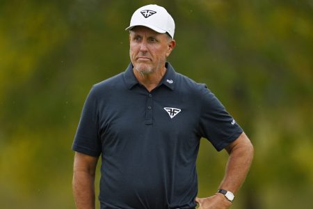 Phil Mickelson reacts after a putt at the LIV Golf Invitational - Chicago.