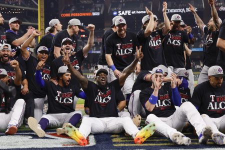 Texas players celebrate after defeating the Orioles in the Divisional Series.