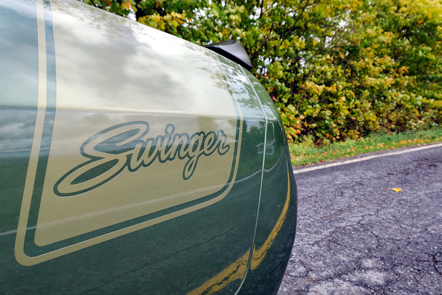 The Swinger logo on the side of a Last Call Dodge Challengera
