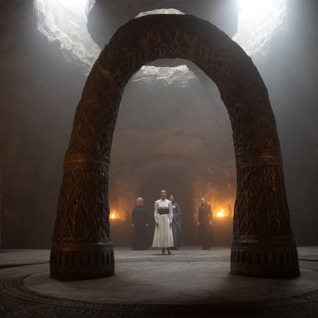 Nynaeve al'Meara stands before the arches in the White Tower in season 2 of The Wheel of Time