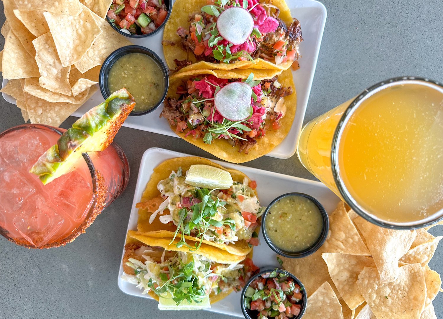Tacos, chips and cocktails on a tray