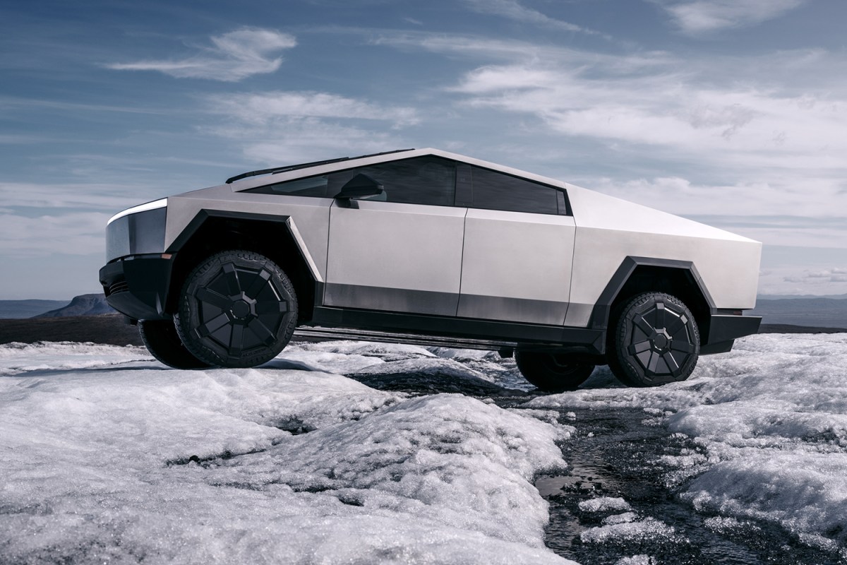 The 2023 Tesla Cybertruck, an electric pickup truck from Elon Musk's EV company, driving across ice and snow