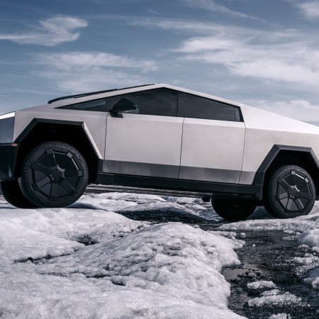The 2023 Tesla Cybertruck, an electric pickup truck from Elon Musk's EV company, driving across ice and snow