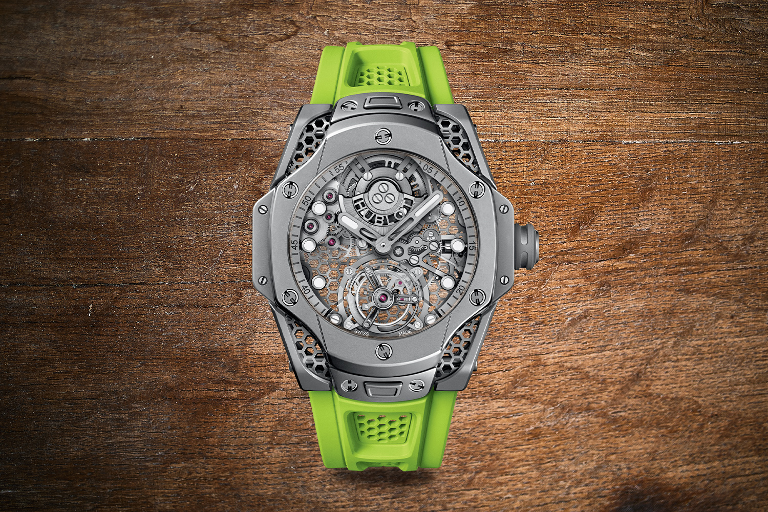 Green and gray watch with a mechanical-looking face 