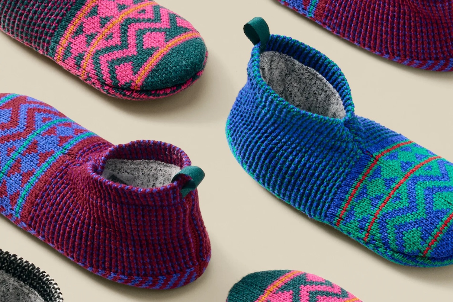 a photo of the Bombas slipper on a tan background