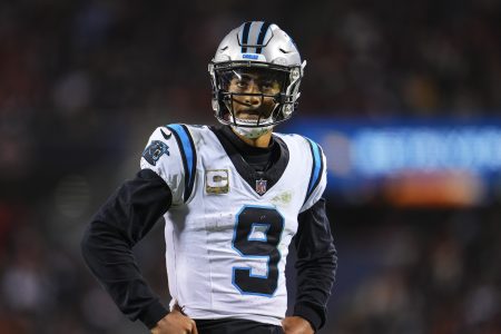 Bryce Young of the Panthers looks on.