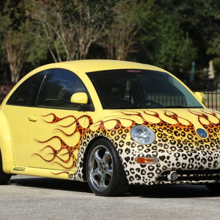 1998 Volkswagen New Beetle with leopard print flames selling as part of the George Foreman Collection, and which was reportedly once owned by Dennis Rodman