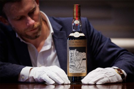 Jonny Fowle, Sotheby's global head of spirits, with The Macallan Adami 1926 at a recent auction.