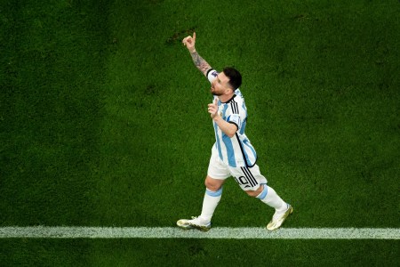 Lionel Messi of Argentina celebrates after scoring the team's first goal via a penalty during the FIFA World Cup Qatar 2022 Final.