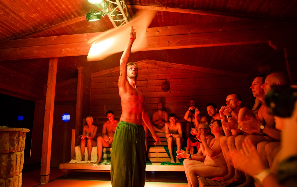A "saunameister" performing aufguss in a sauna.