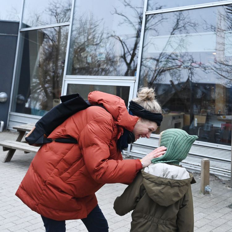 A Danish mother dropping off her son at kindergarten.