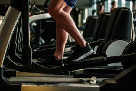A man going backwards on an elliptical.