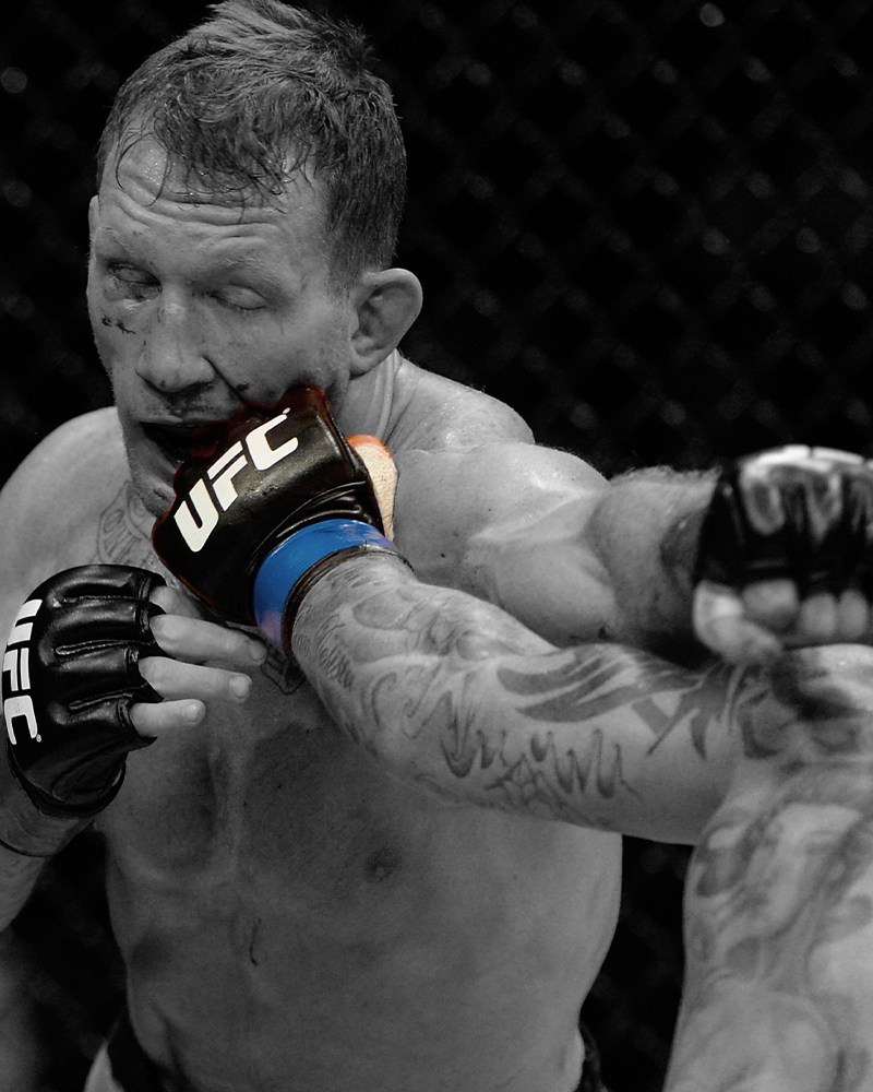 Gray Maynard, a former UFC fighter, getting punched in the face during a bout in 2014. Maynard is now automatically part of a class-action antitrust lawsuit against the UFC.