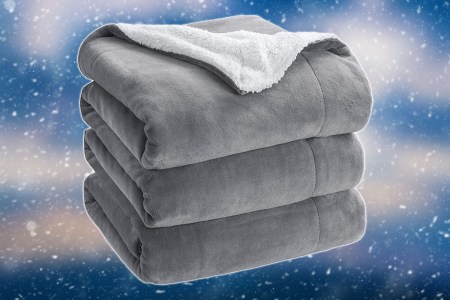 a grey Bedsure blanket on a snowy blue background