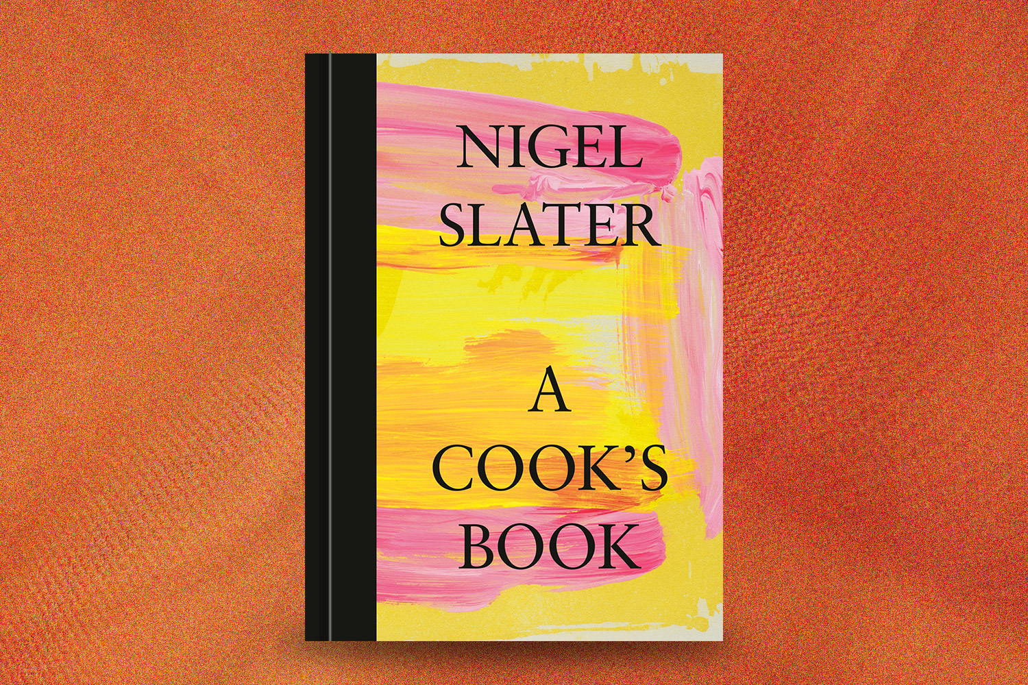 a cook's book on an orange background
