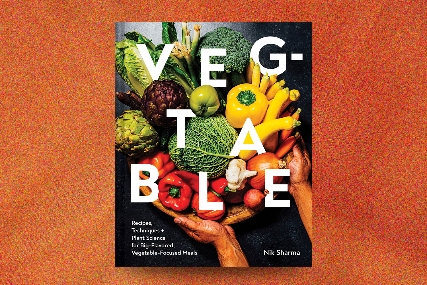 Veg-Table cookbook on an orange background
