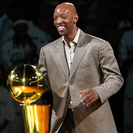 Sam Cassell posing with the championship trophy in 2008.