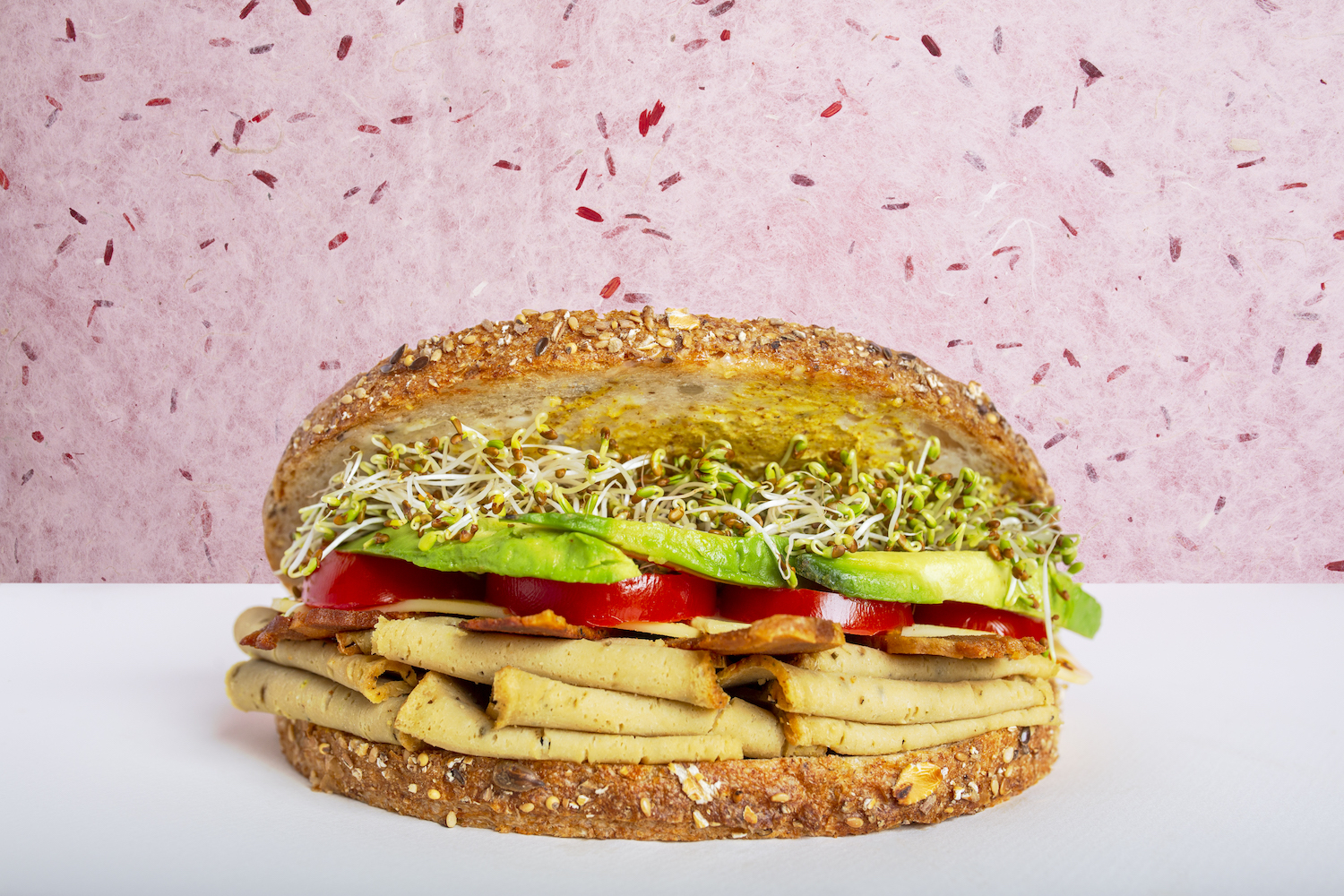 vegan turkey sandwich on a white table