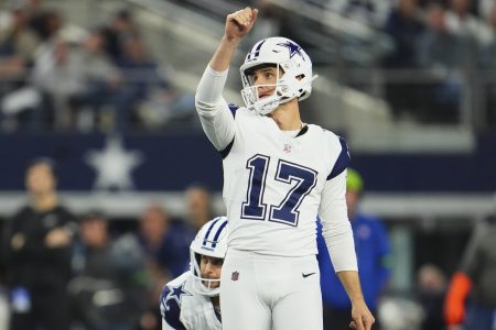 Dallas kicker Brandon Aubrey celebrates after making a kick.