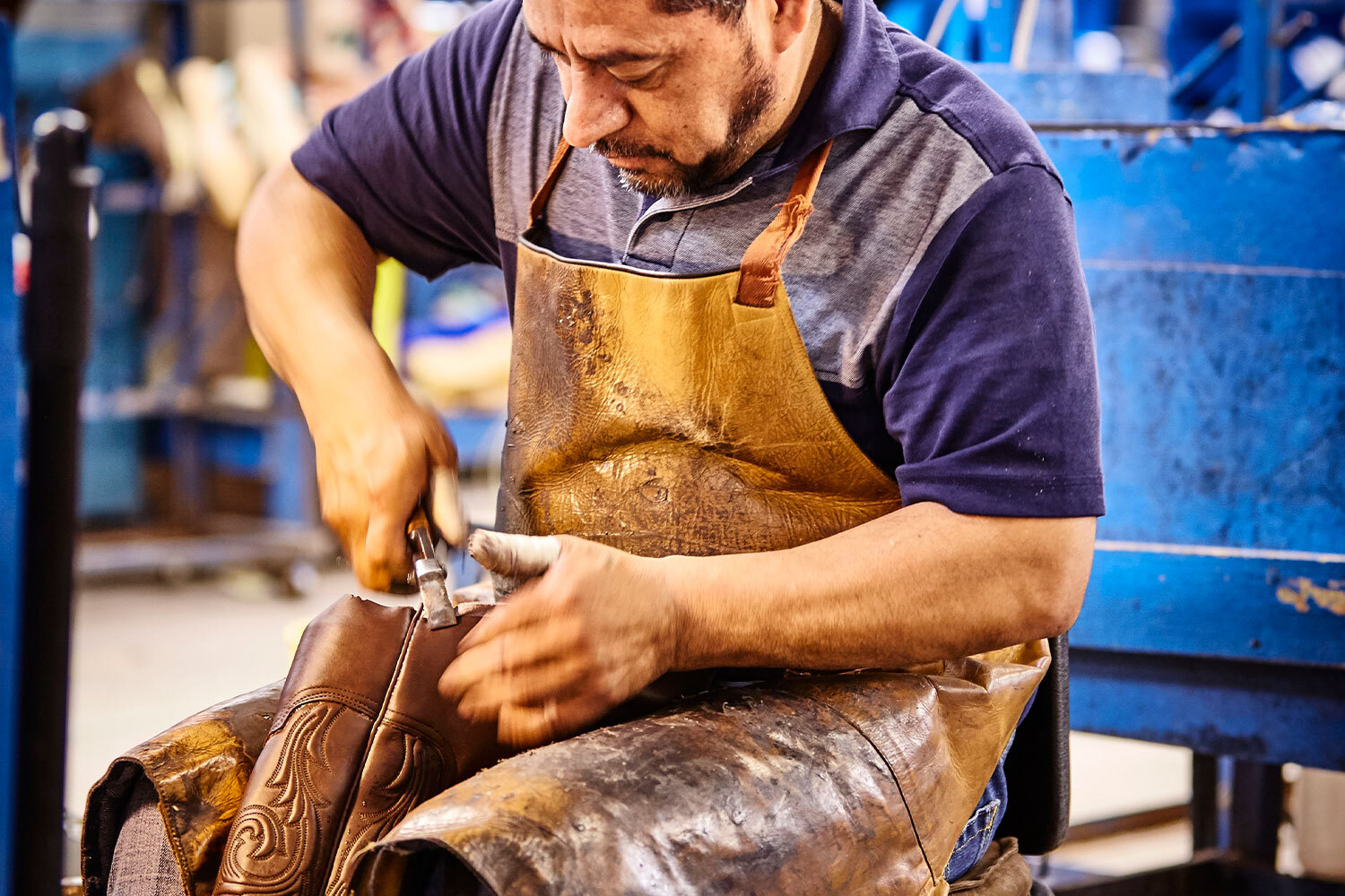An employee works on a boot in the Lucchese factory.