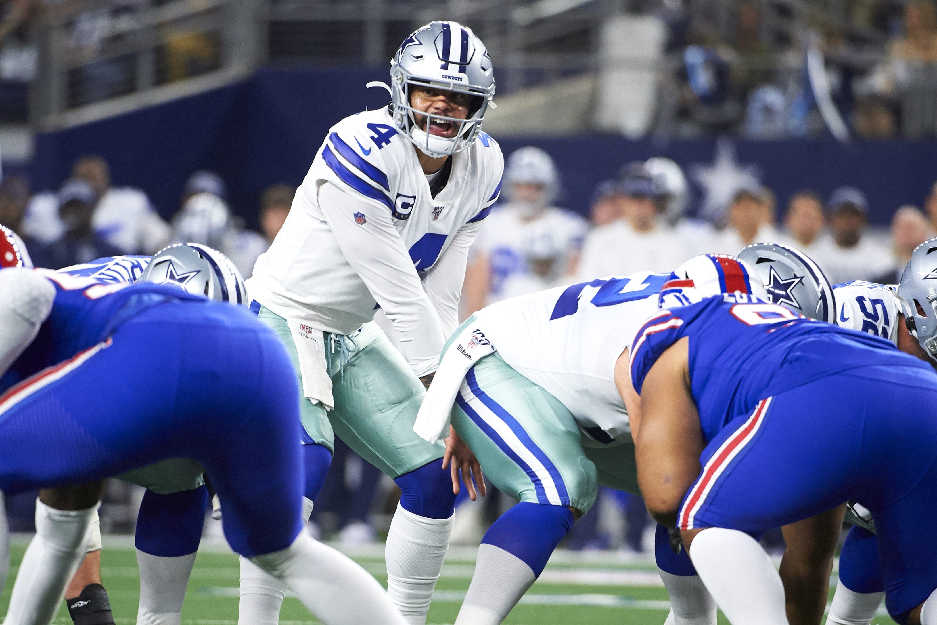 Dallas quarterback Dak Prescott calls a play at the line of scrimmage.