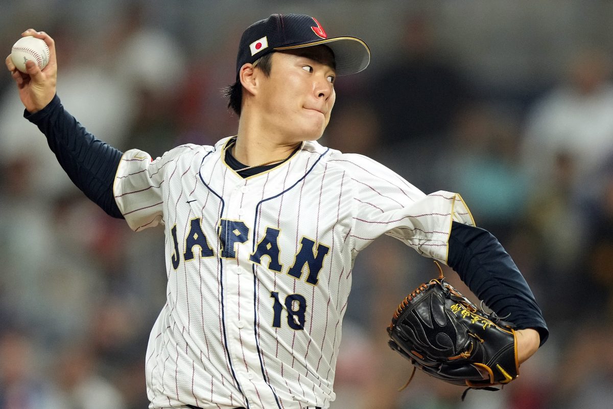 Yoshinobu Yamamoto pitches for Team Japan.