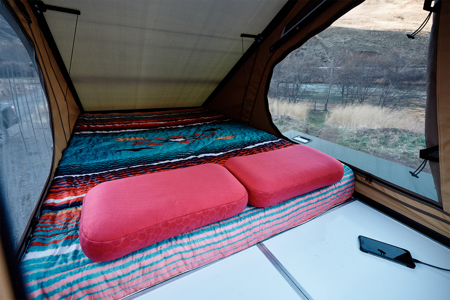 The inside of the Super Pacific X1 canopy camper with the inflatable mattress