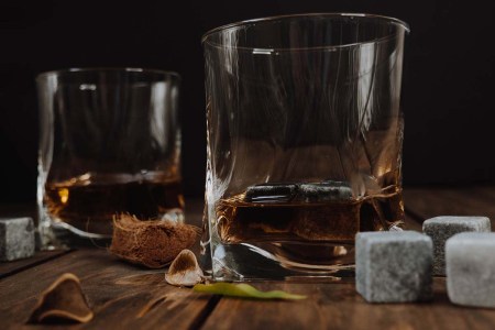 Two glasses of whisky with whisky stones, which are terrible for your drink