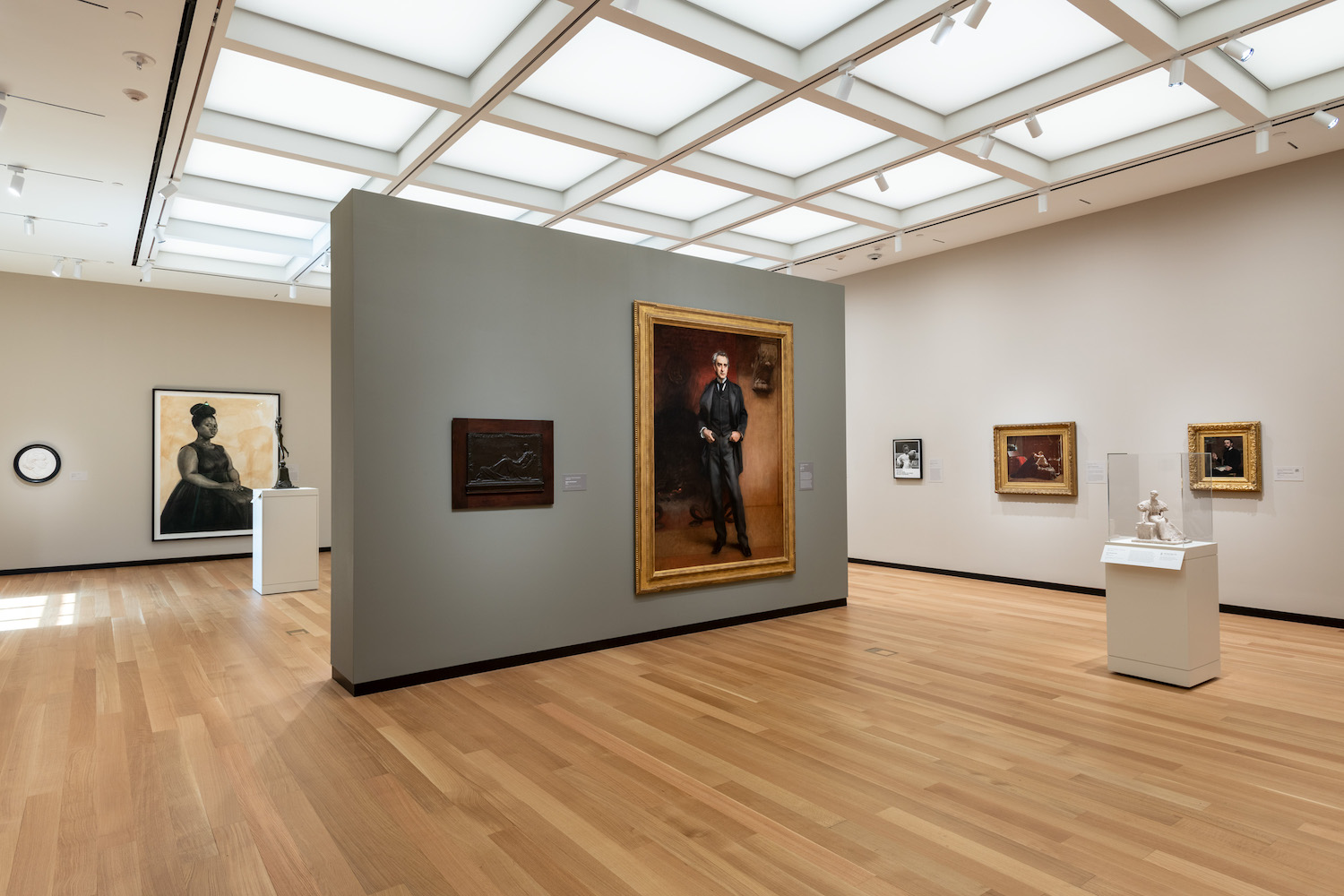 Interior of Amon Carter Museum of American Art with paintings on walls 