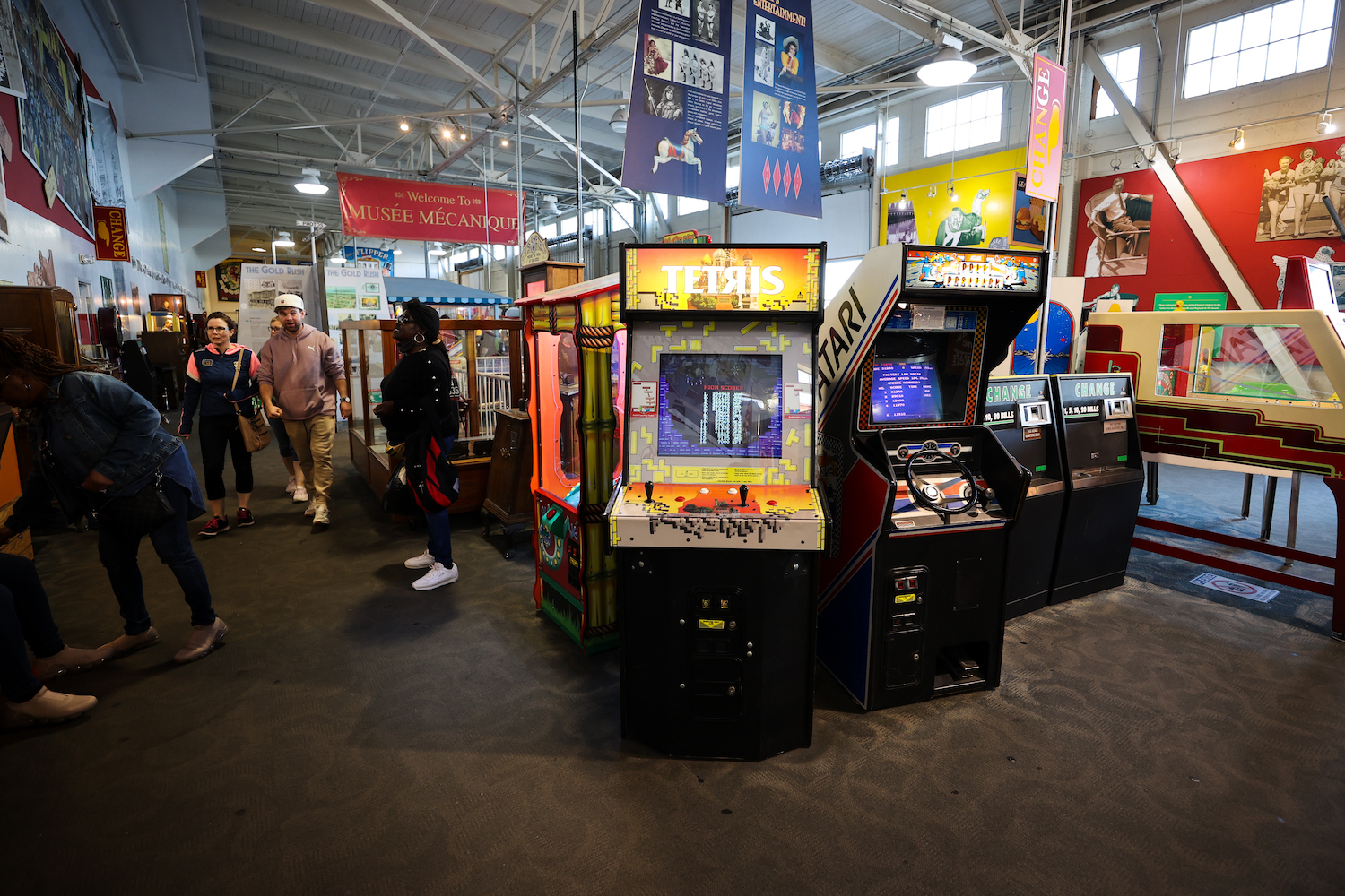 People enjoy in the Musee Mecanique, an antique coin operated arcade at Fisherman's Wharf in San Francisco, California