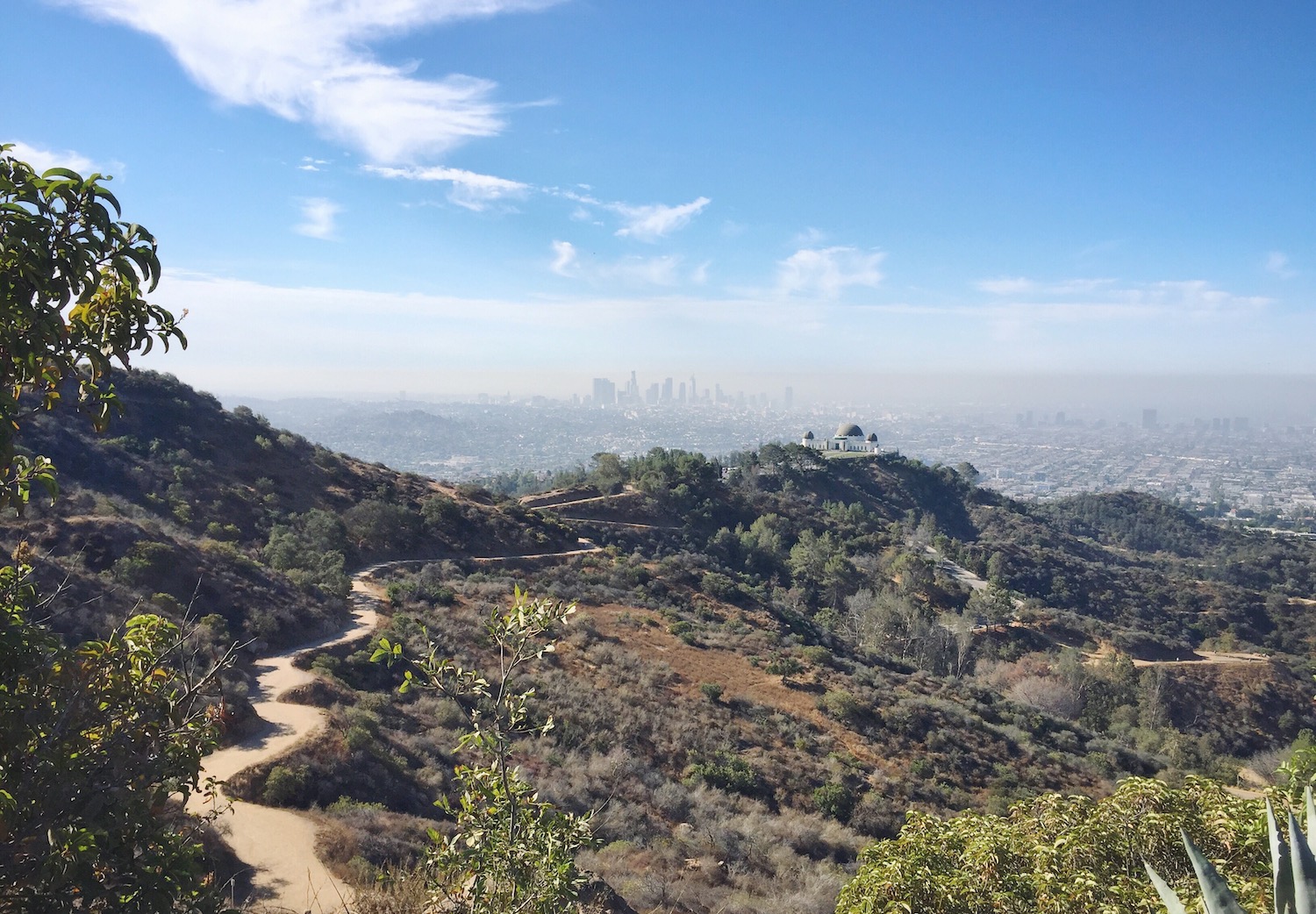 View of city, trail and mountains from a peak at Griffith Park 