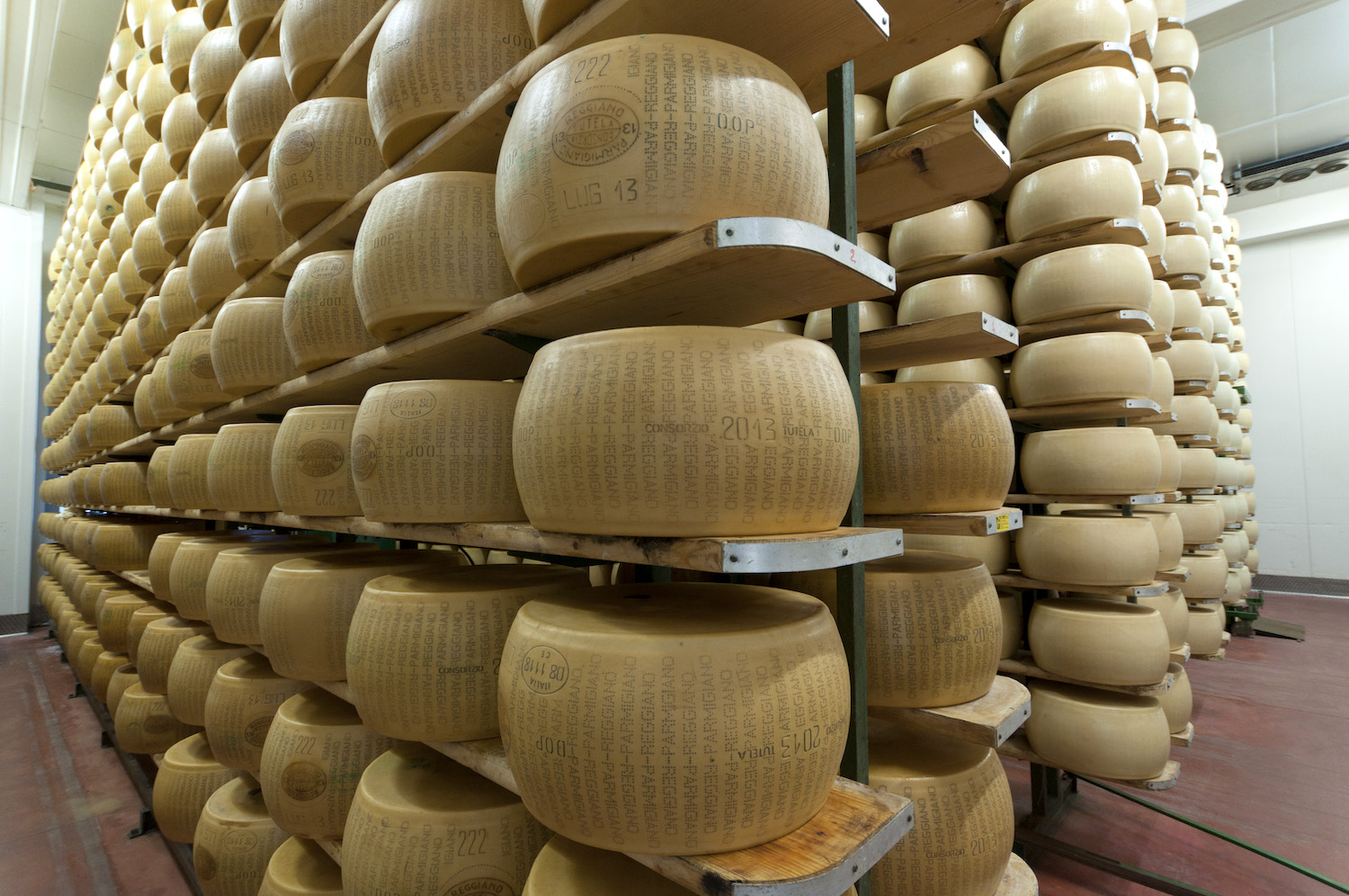 wheels of Parmigiano Reggiano with the official PDO seal