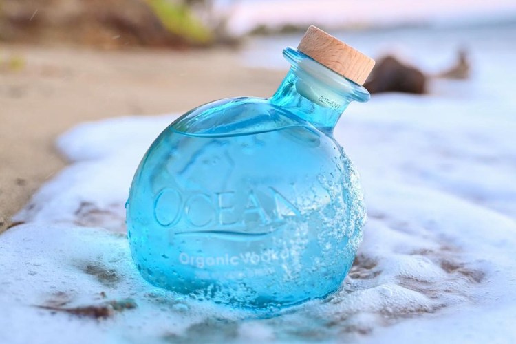Ocean Organic Vodka bottle on a beach