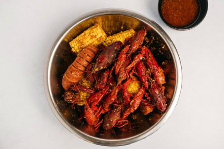 Crawfish in a bowl seasoned with corn on the cob