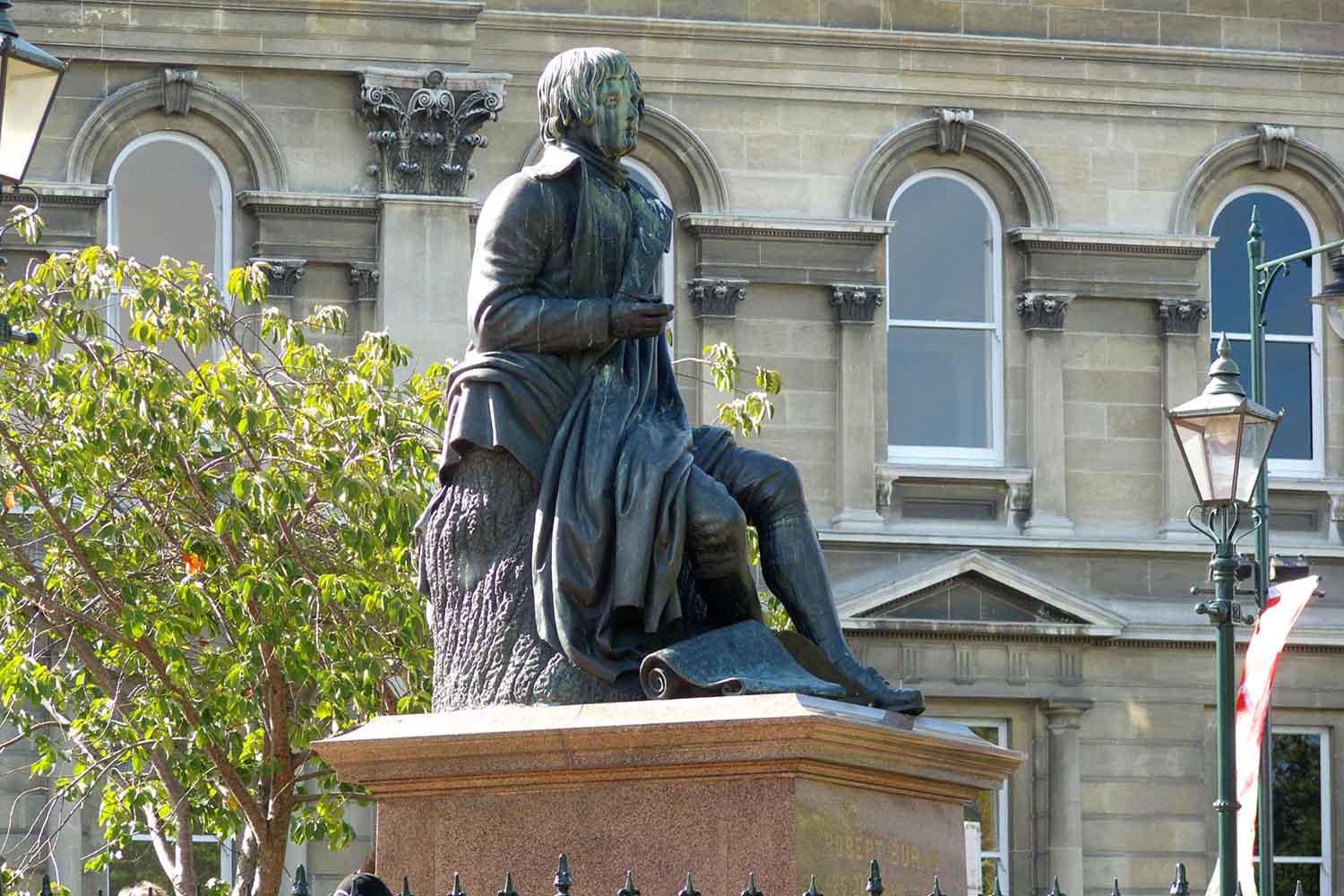 The over 100 year old statue of poet Robbie Burns sits in The Octagon