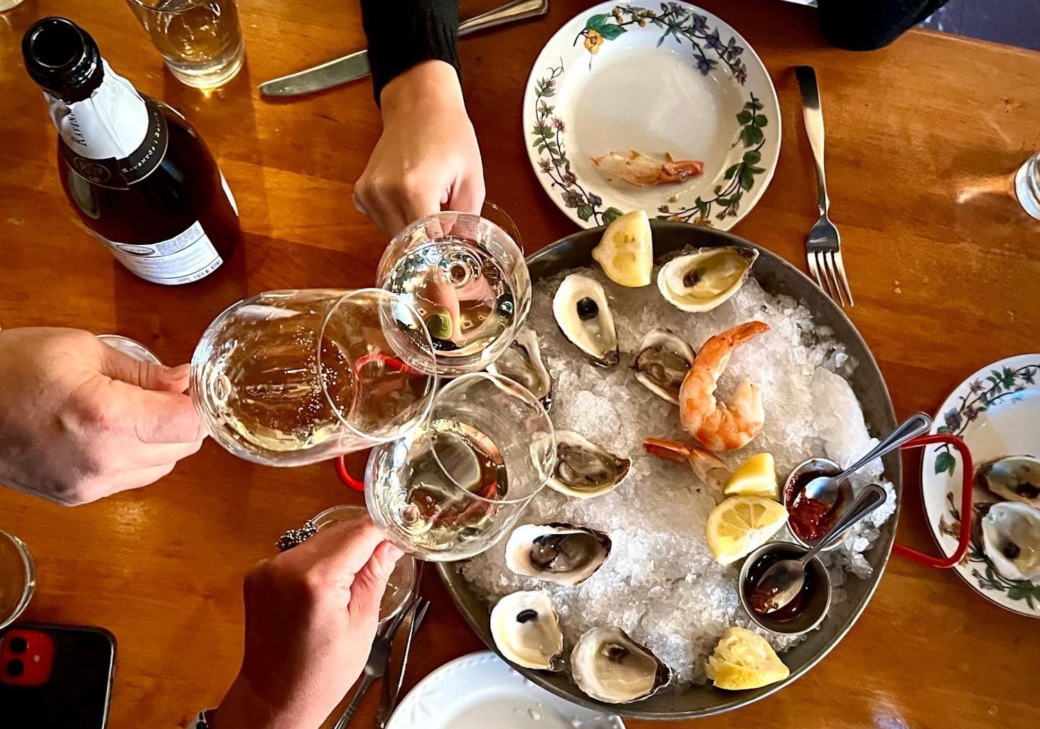 Birds-eye view of oysters and wine 