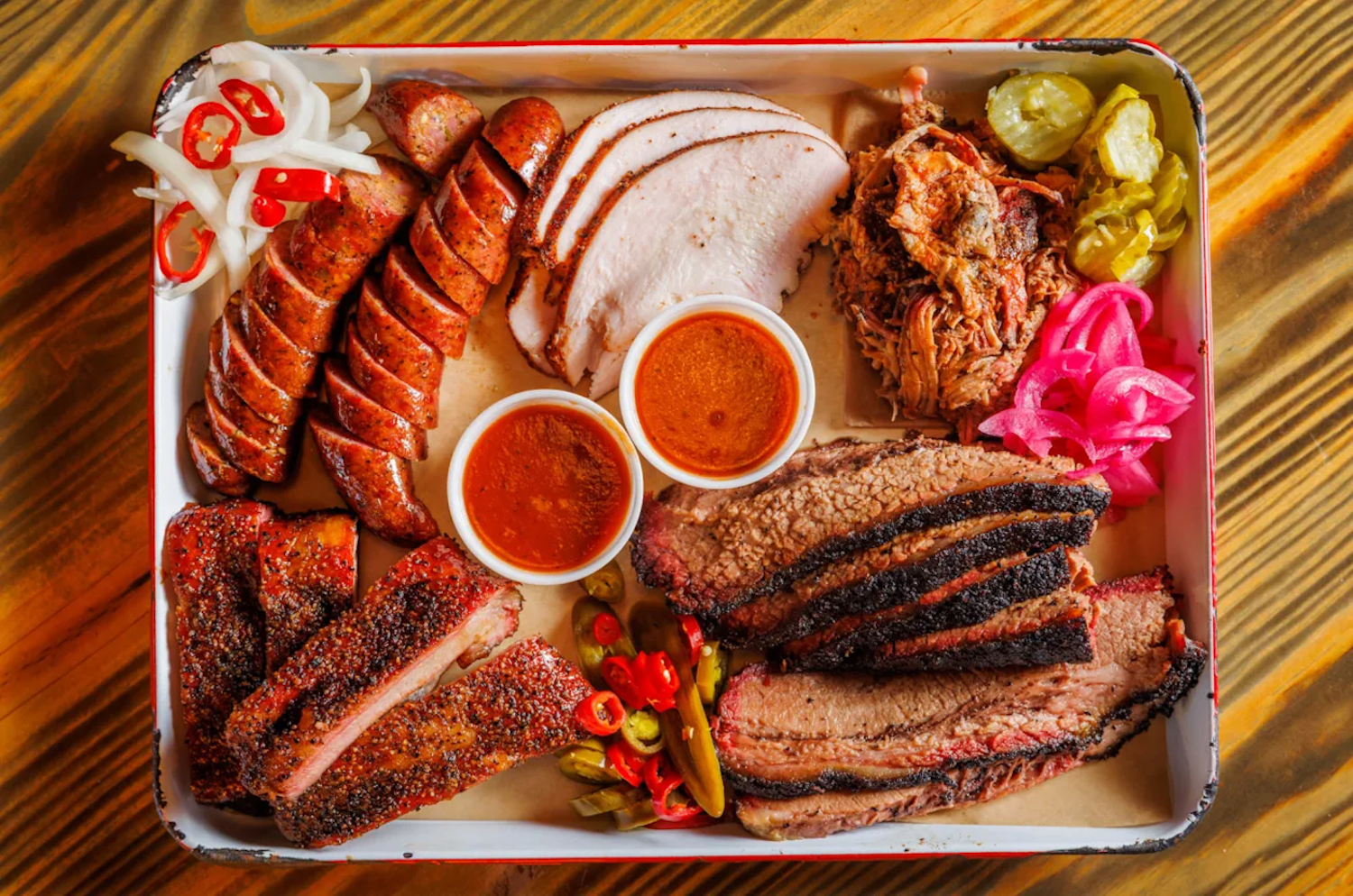 BBQ tray with meat, sauces and other sides 